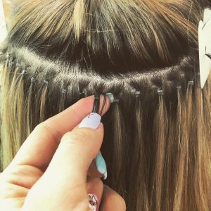 Sew-in weft hair extensions